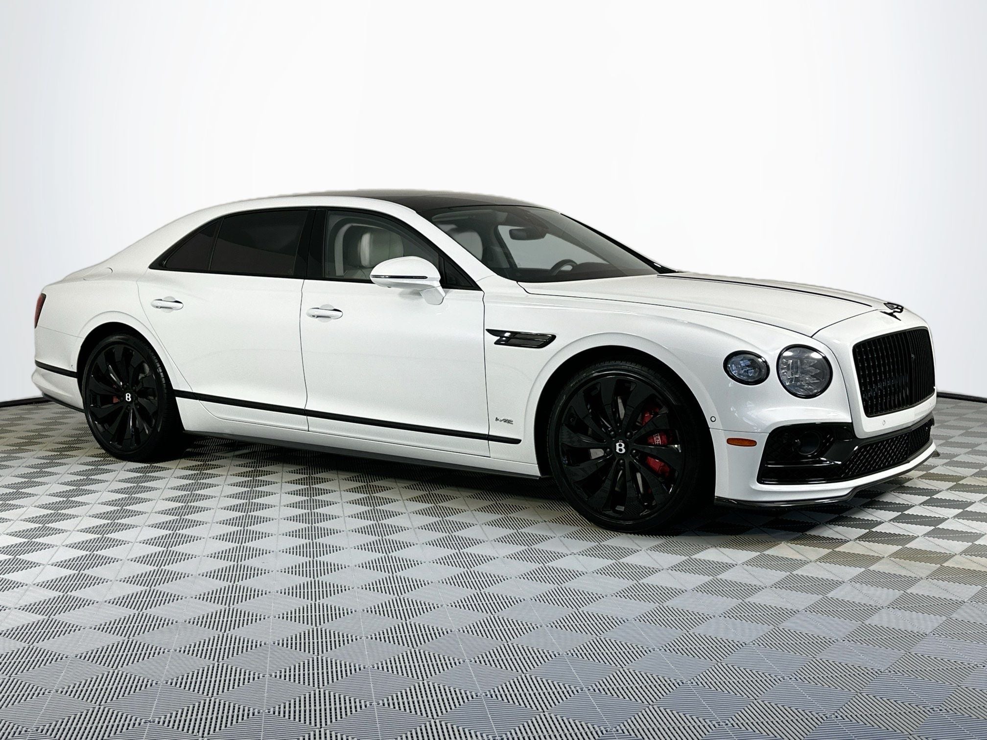 2022 Bentley Flying Spur W12 in Snow Quartz Pearlescent By Mulliner — front three-quarter view