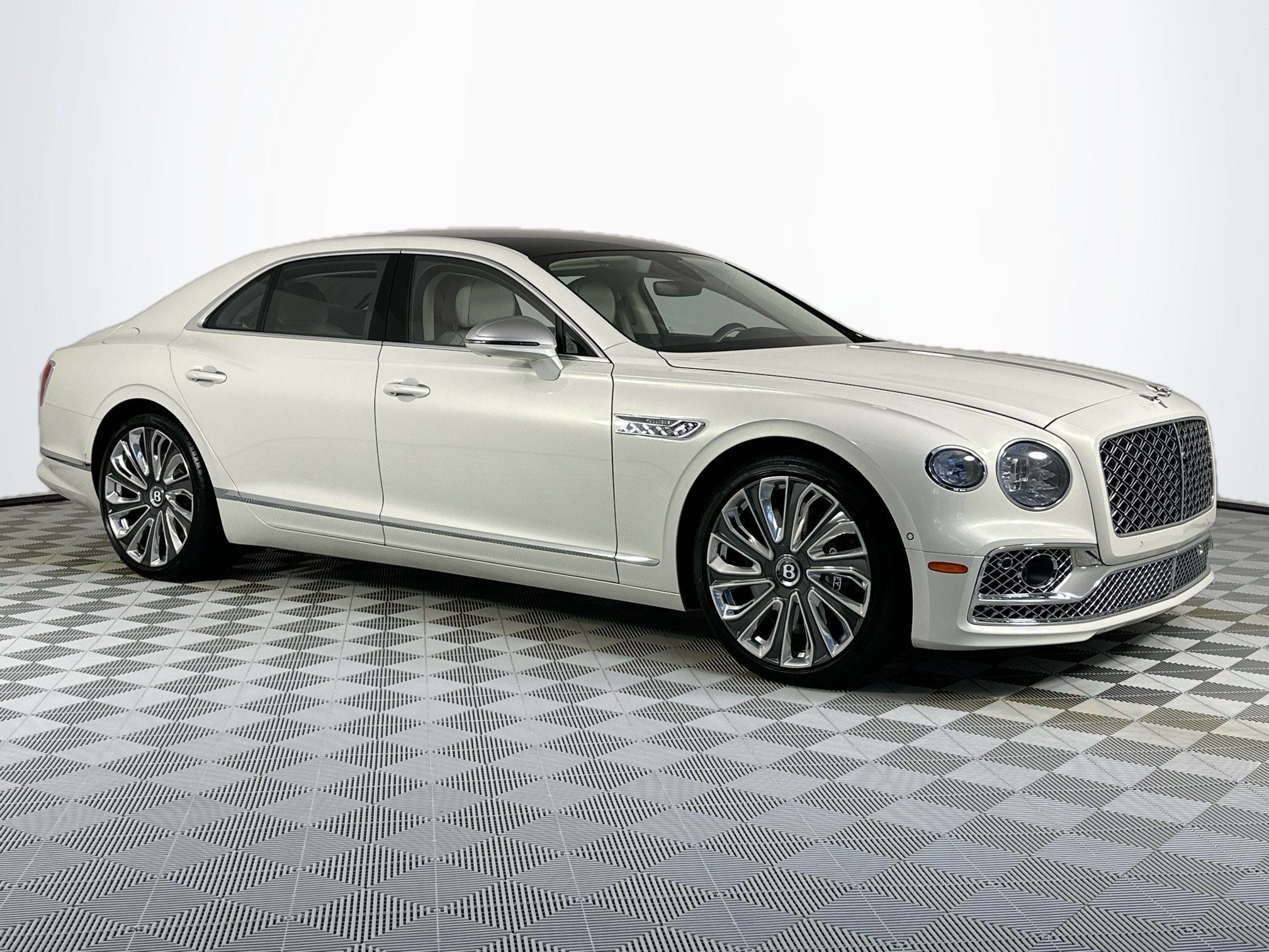 2024 Bentley Flying Spur Mulliner W12 in Ghost White (Pearlescent) — front three-quarter view