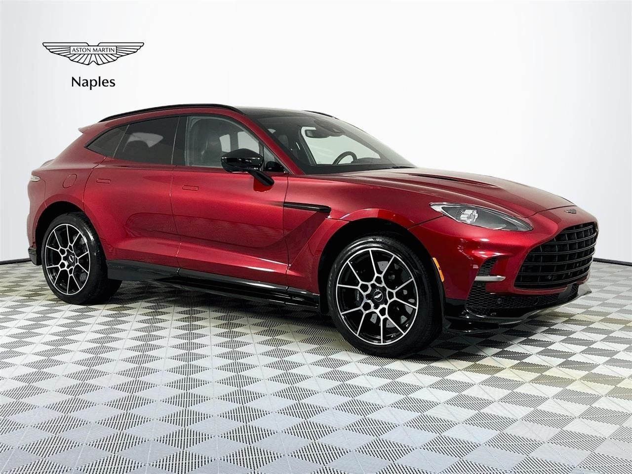 2023 Aston Martin DBX 707 in Supernova Red — front three-quarter view